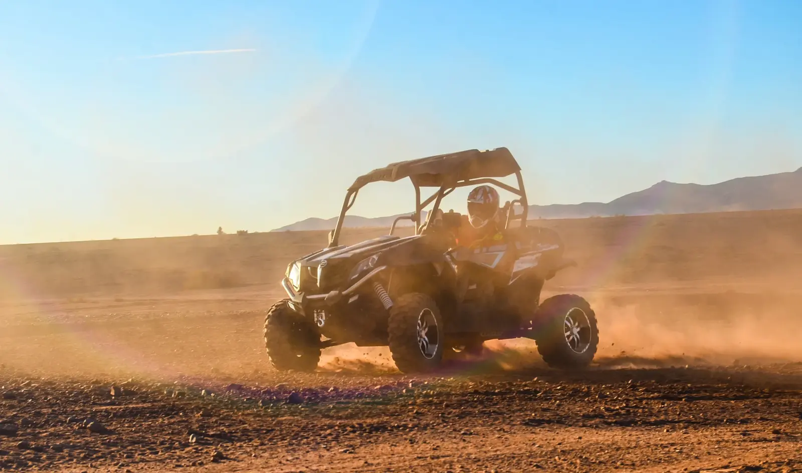 A buggy driving across the stony Agafay Desert