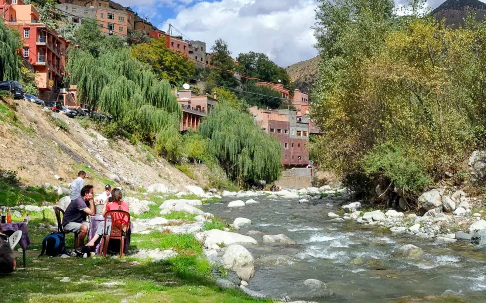 Travellers resting beside the river in the Ourika Valley